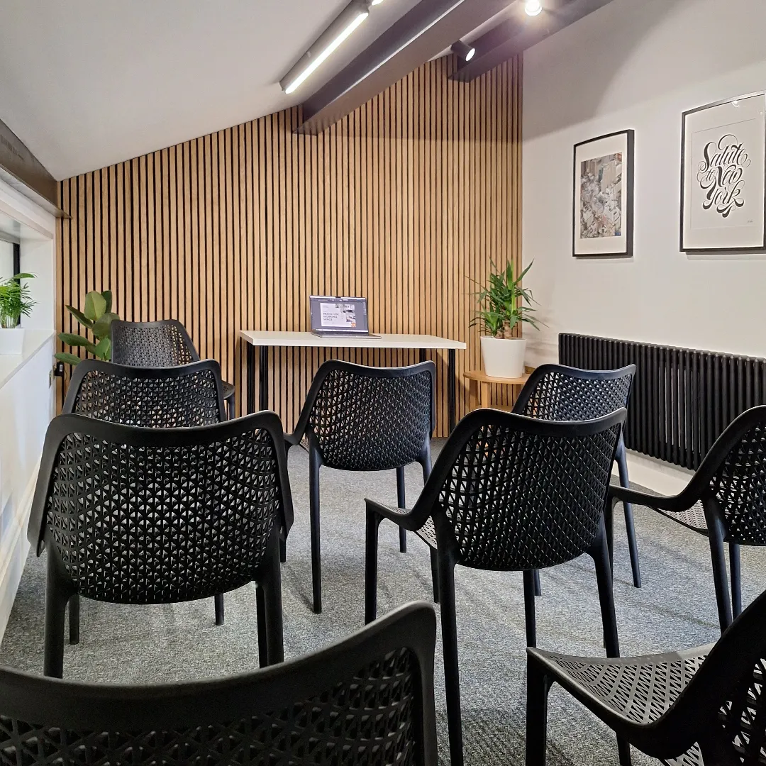 Salem meeting room set up with tables and chairs