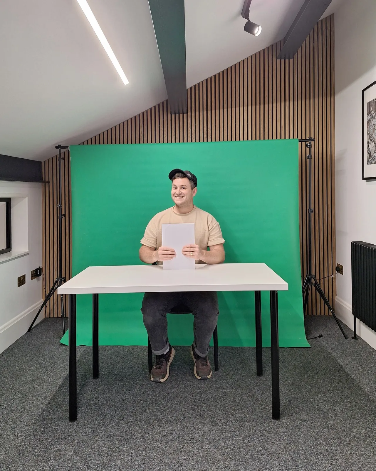A green screen set up behind a desk at Spring Grove Stables