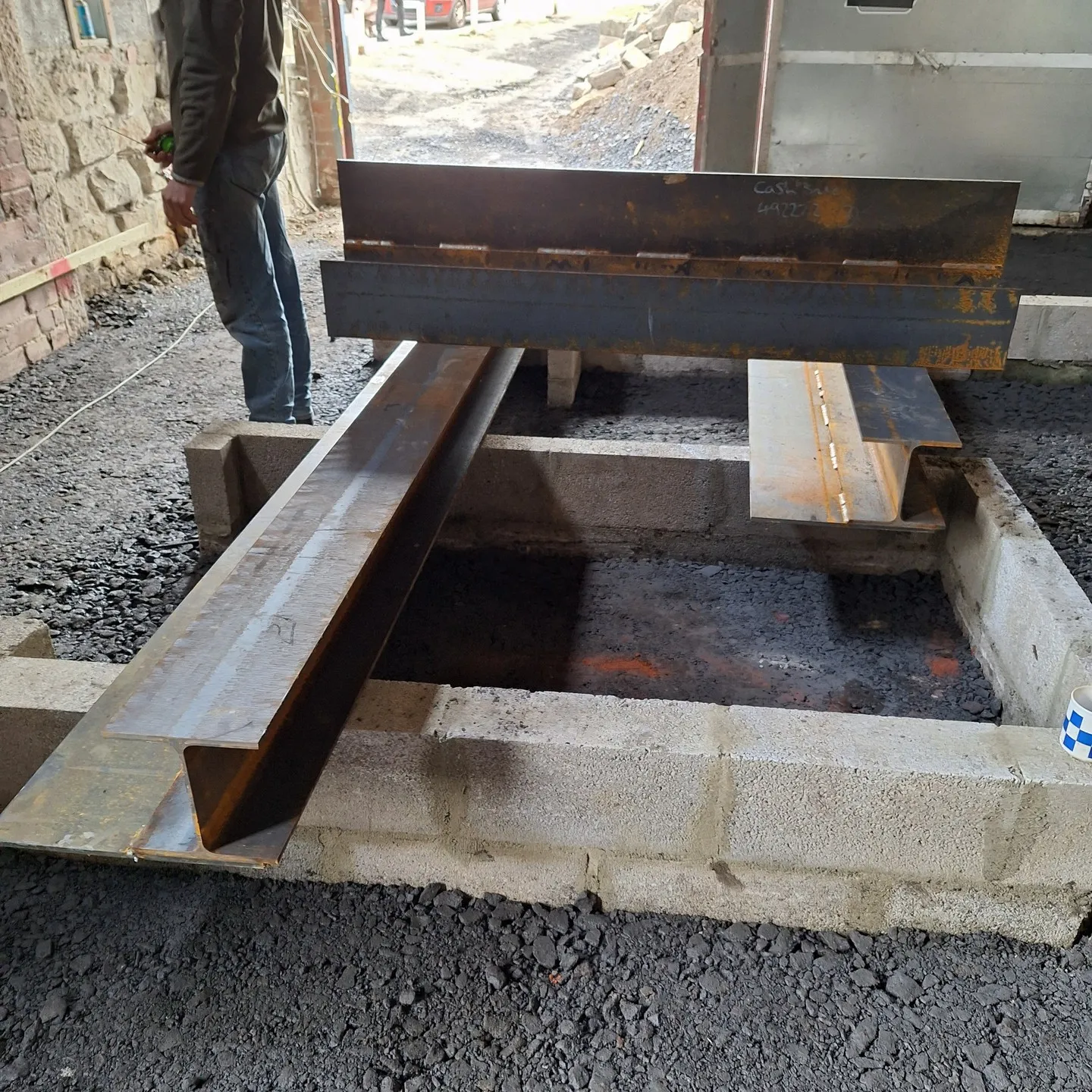 New steel lintels laid out ready for installation