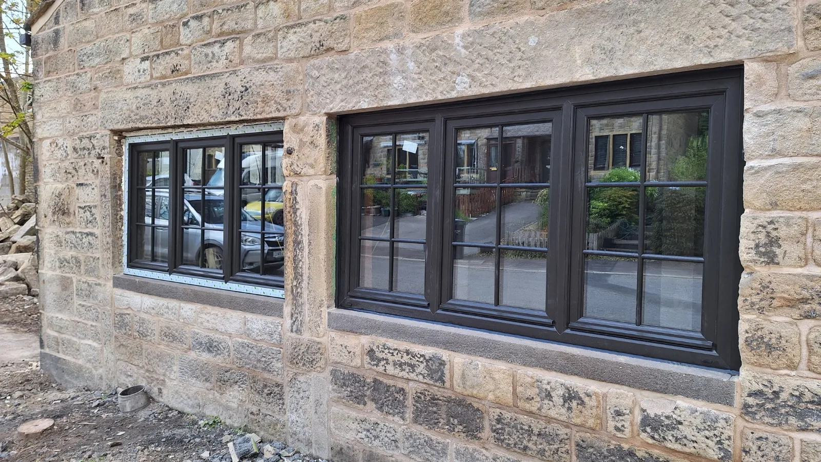 New black Georgian-style windows set into the stone walls